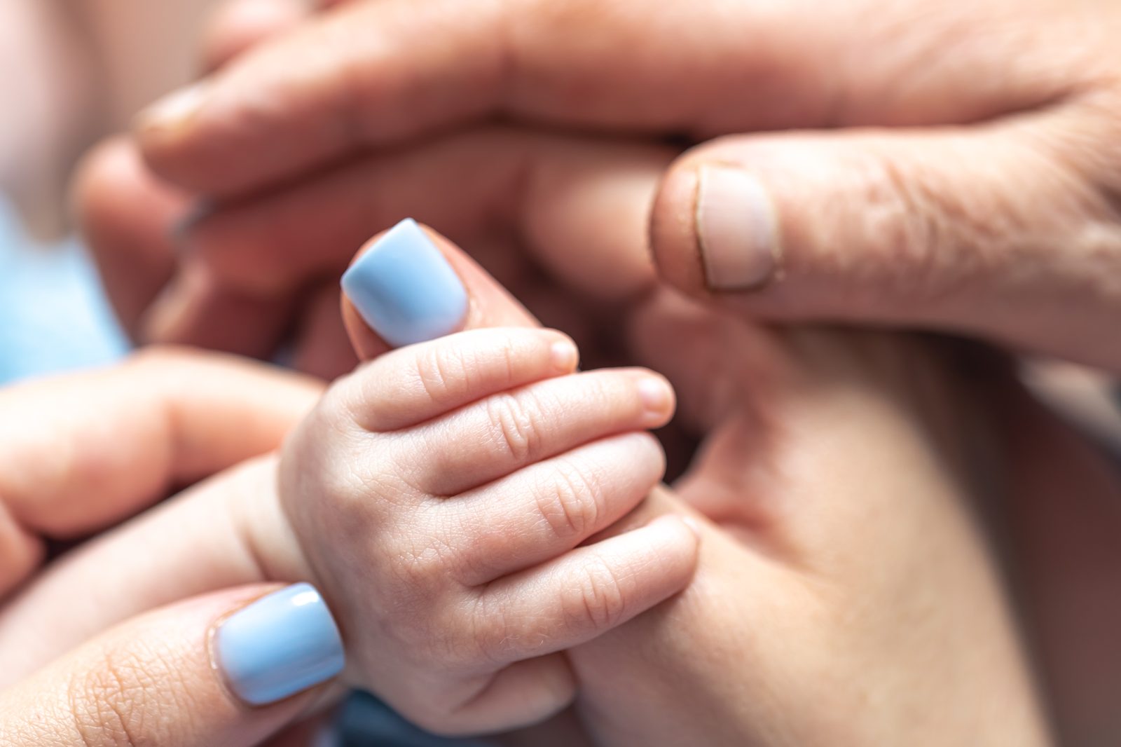 Three generations of hands, for a birth certificate attestation for family use abroad